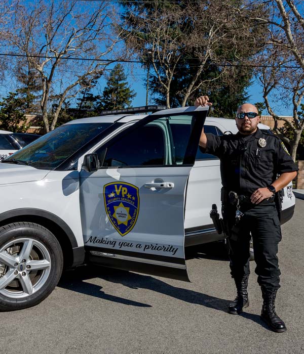 security professional by patrol car