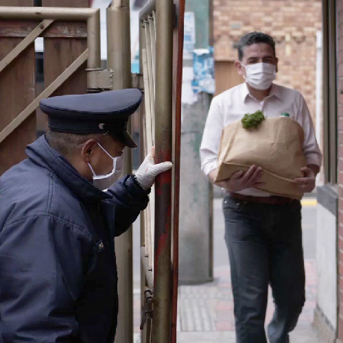A Security Guard Opening the Gate for a Man in San Jose, CA