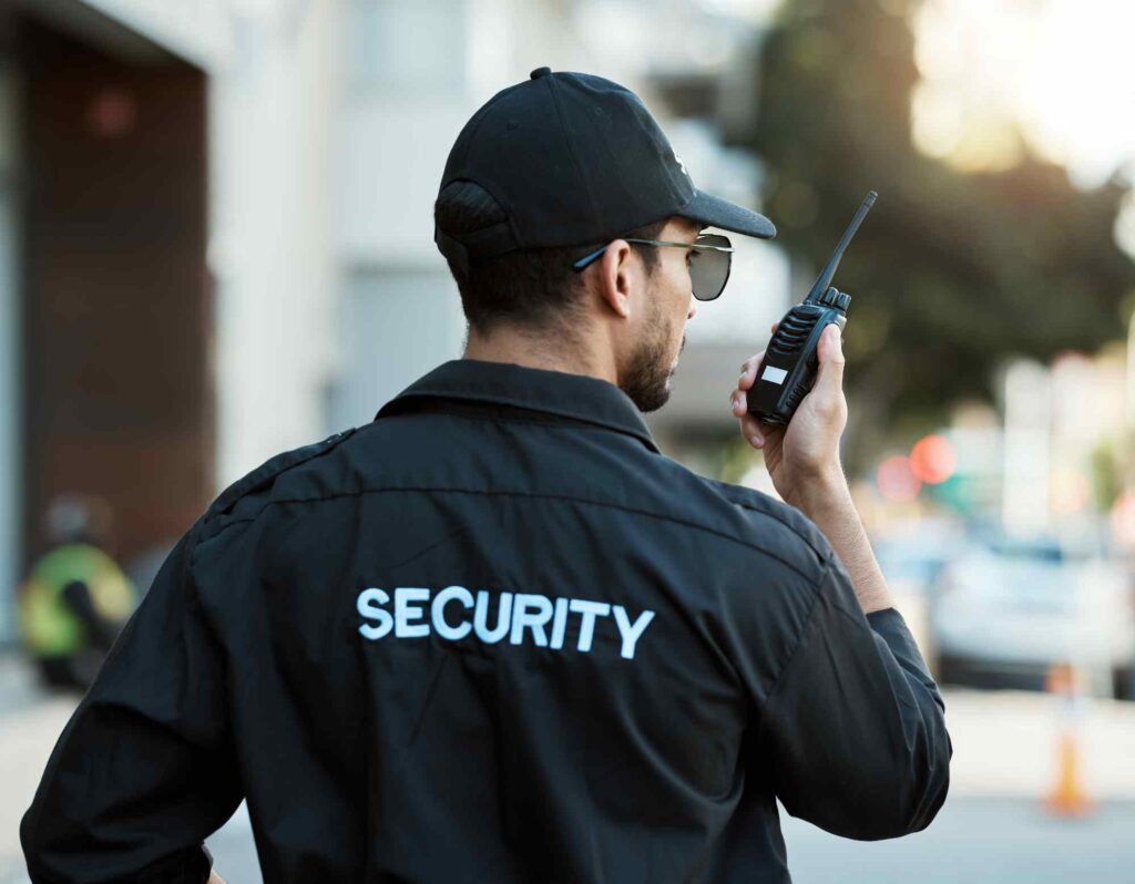 Security Guard in Uniform Holding a Walkie-Talkie Outdoors in San Jose, CA